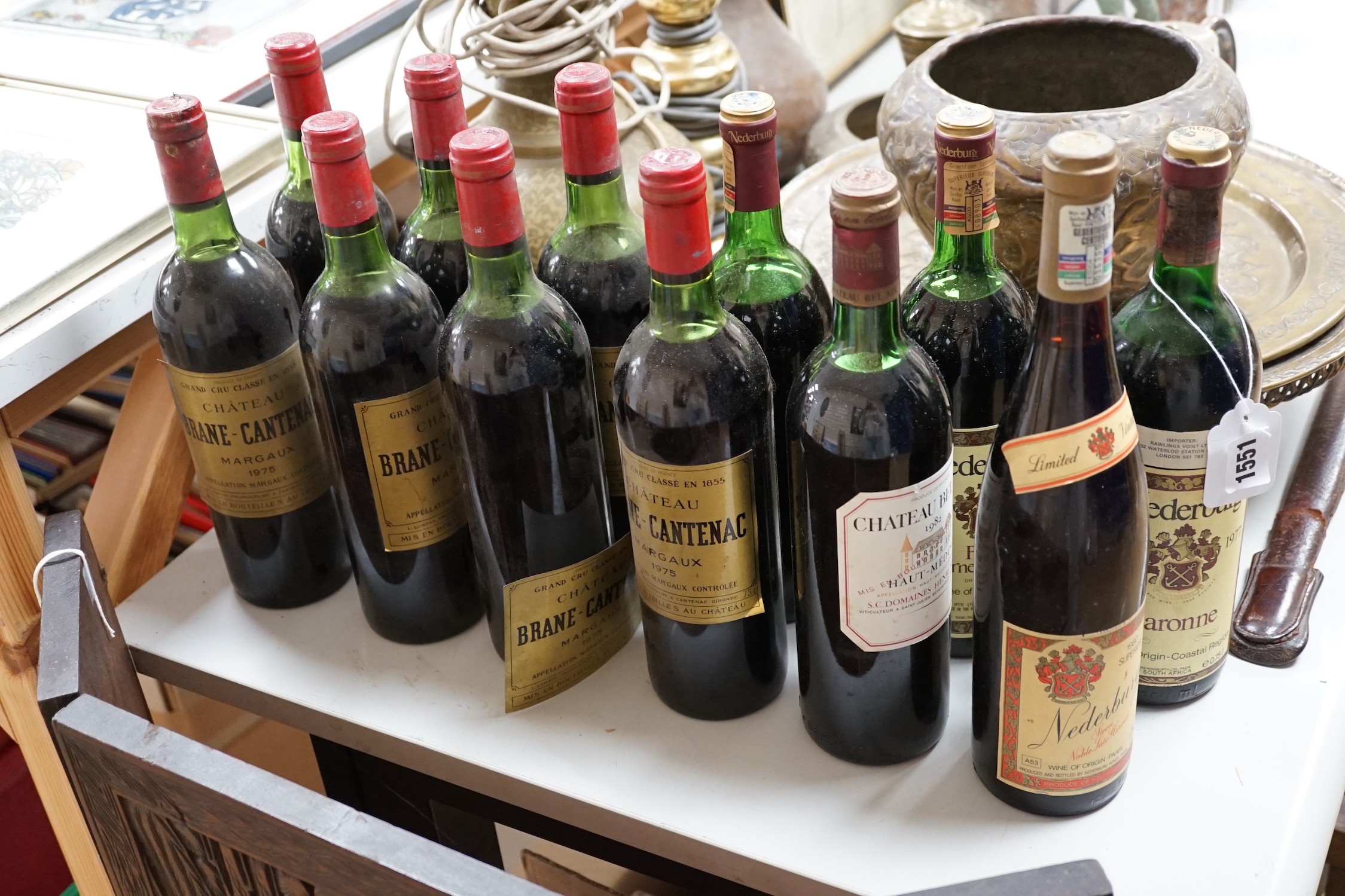 Seven bottles of 75cl 1975 Chateau Brane-Cantenac Margaux, together with a bottle of 75cl 1982 Chateau Bel Air Haut-Medoc and four bottles of 75cl Nederburg; two 1981 Paarl Cabernet Sauvignon, one 1977 Baronne and one bo